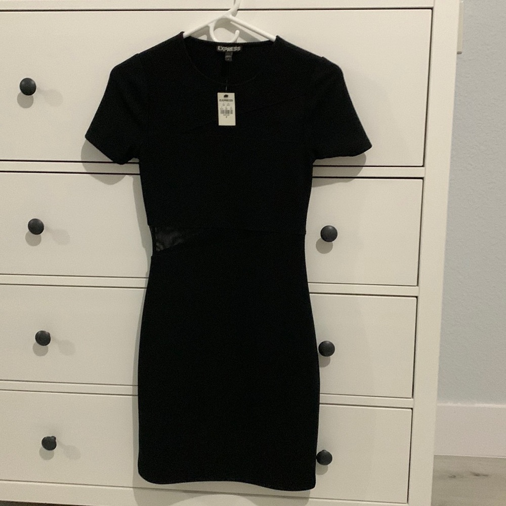 Body-con style LBD with mesh details.